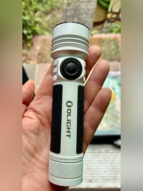 🔦 Olight Compact White and Black Tactical Flashlight